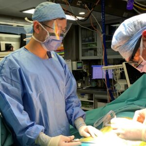 Jeremy Chua (trainee intern) working on the Mobile Surgical Unit - Te Waka Hauora